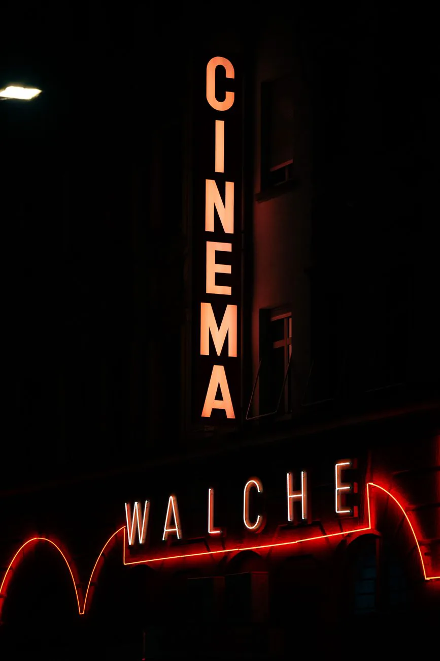 Glowing neon sign on a dark wall