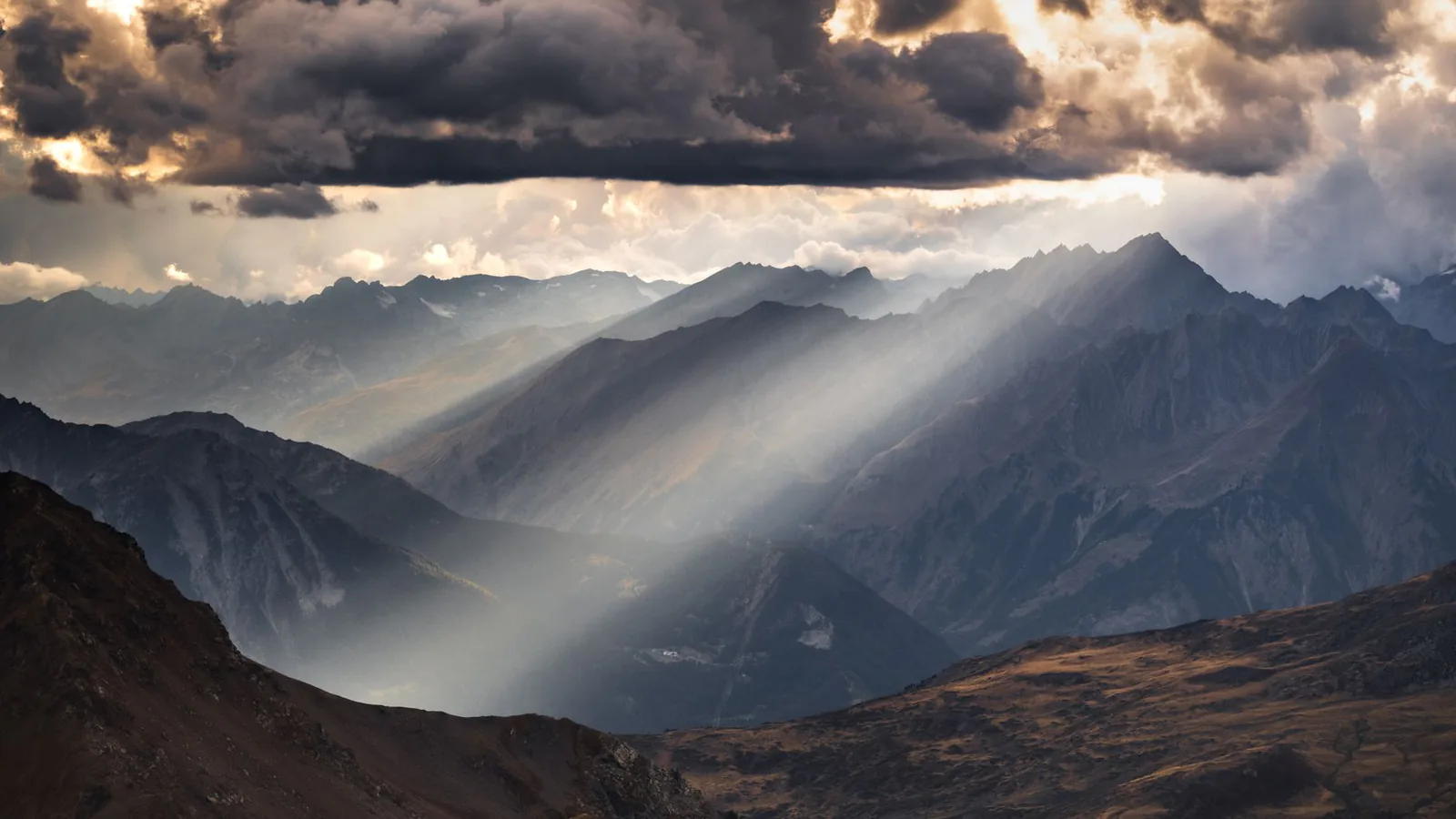 Sun beams breaking over mountains